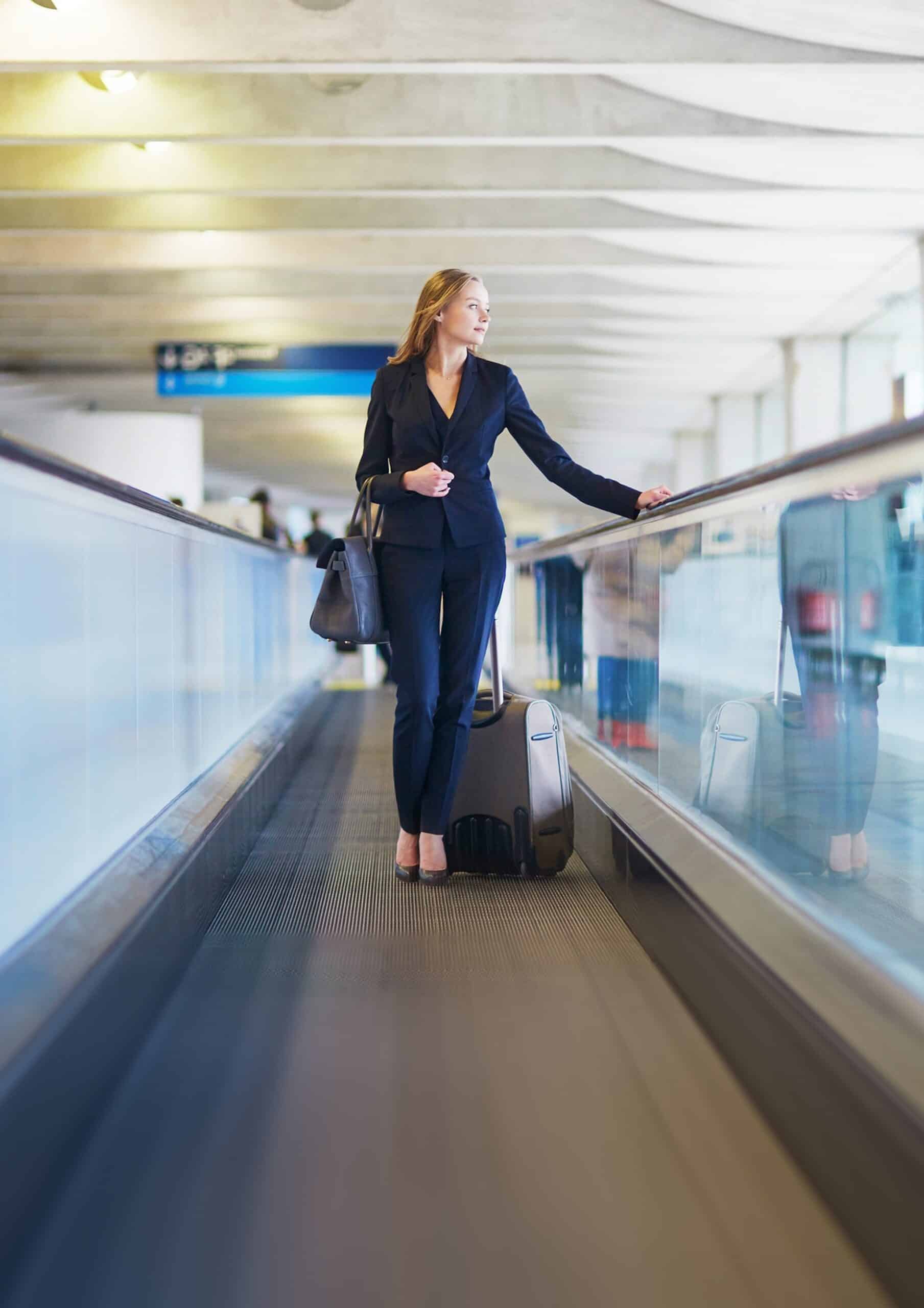 Image of a young woman on a travelator at an international airport