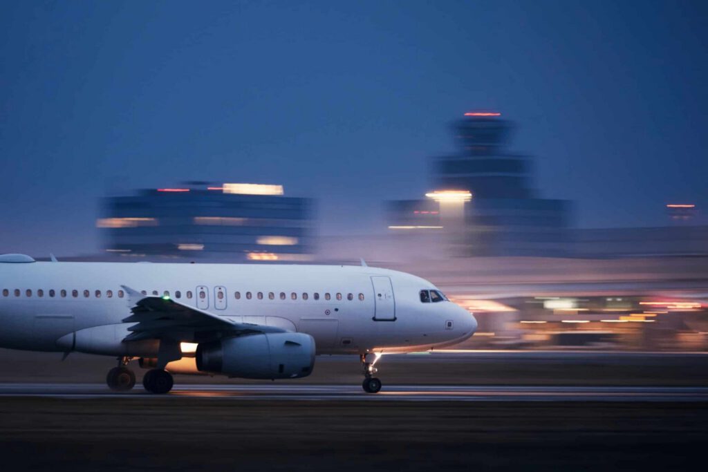 Airplane taking off at dusk